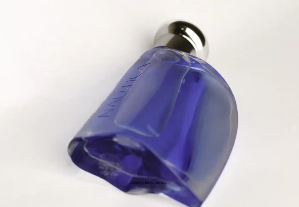 Nautica Blue cologne bottle laying sideways